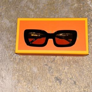 Poppy Lissiman yellow tint sunglasses